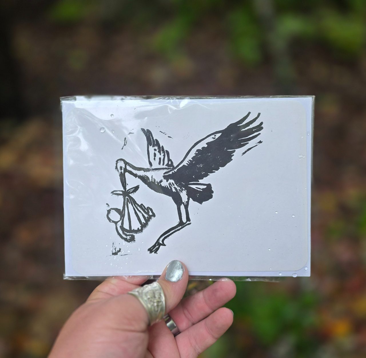 Stork Carrying Baby Card
